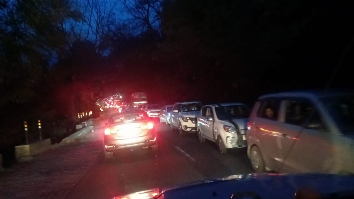 Passengers stuck in a jam on the Red Bridge on Doon Highway