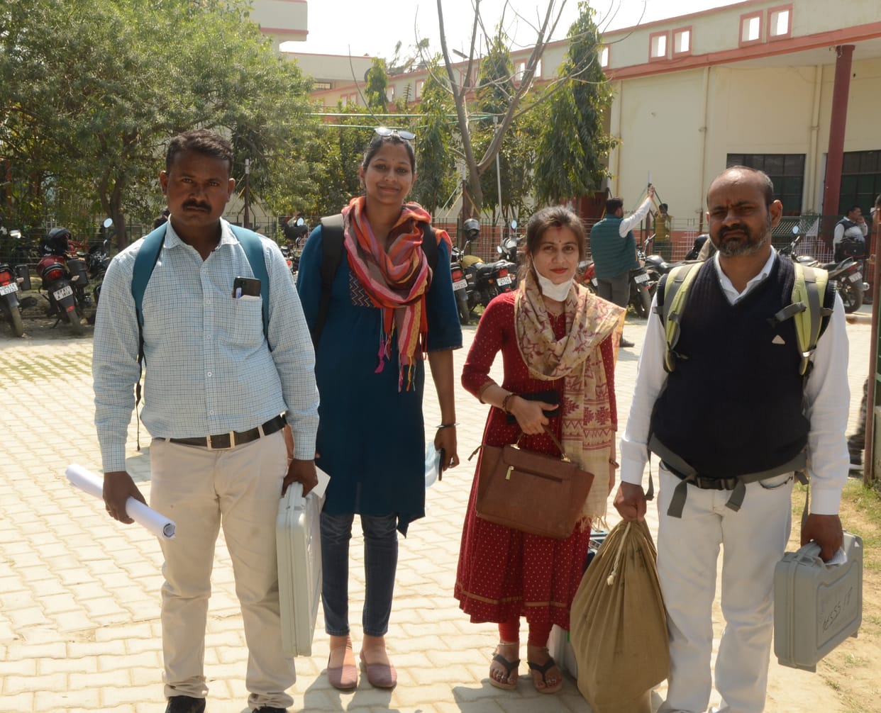 Polling parties left for booths with EVMs and polling material