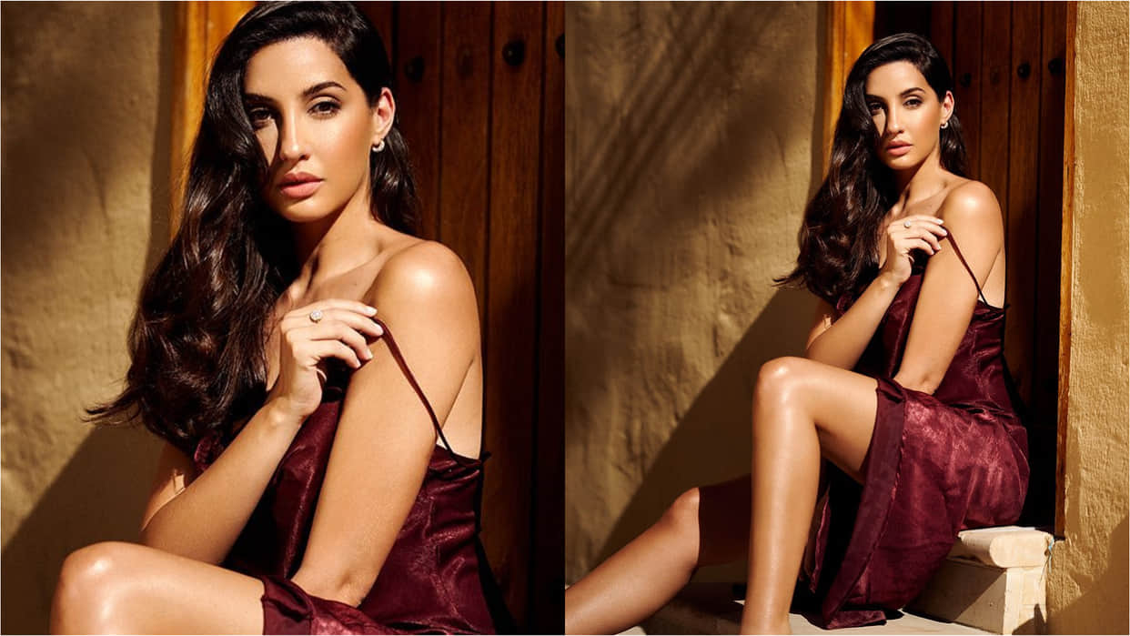 nora fatehi glow in white mini dress adorn with feather