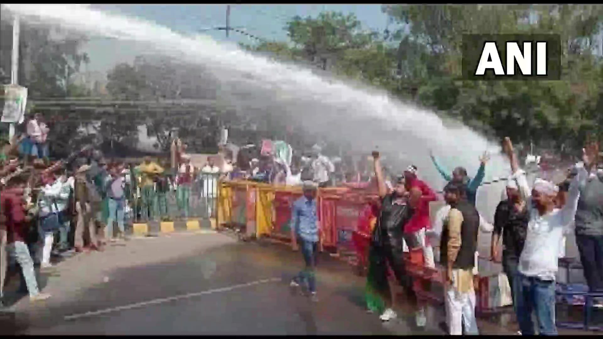 Police use water cannons to disperse the workers of Jan Adhikar Party