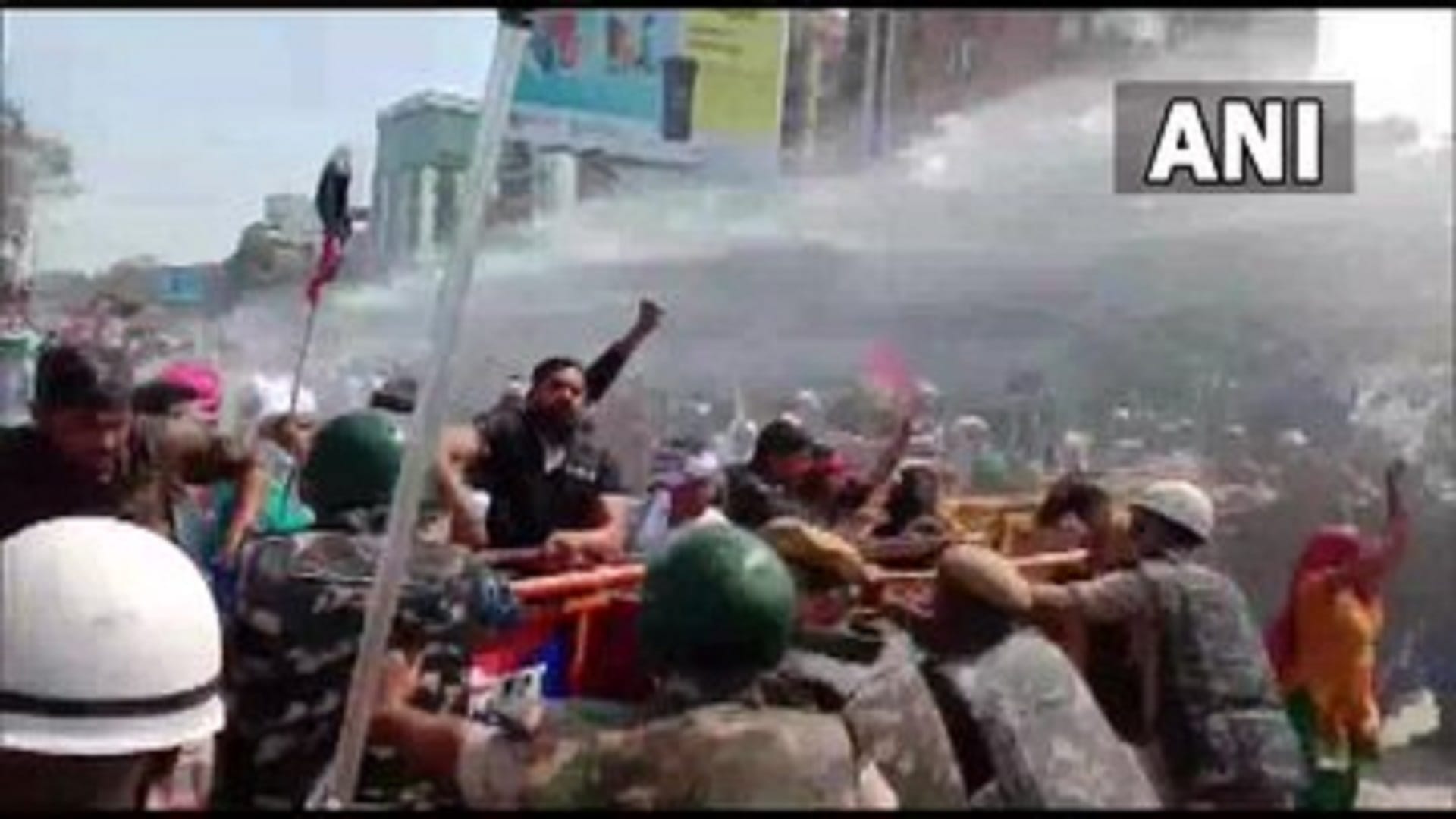 Police use water cannons to disperse the workers of Jan Adhikar Party