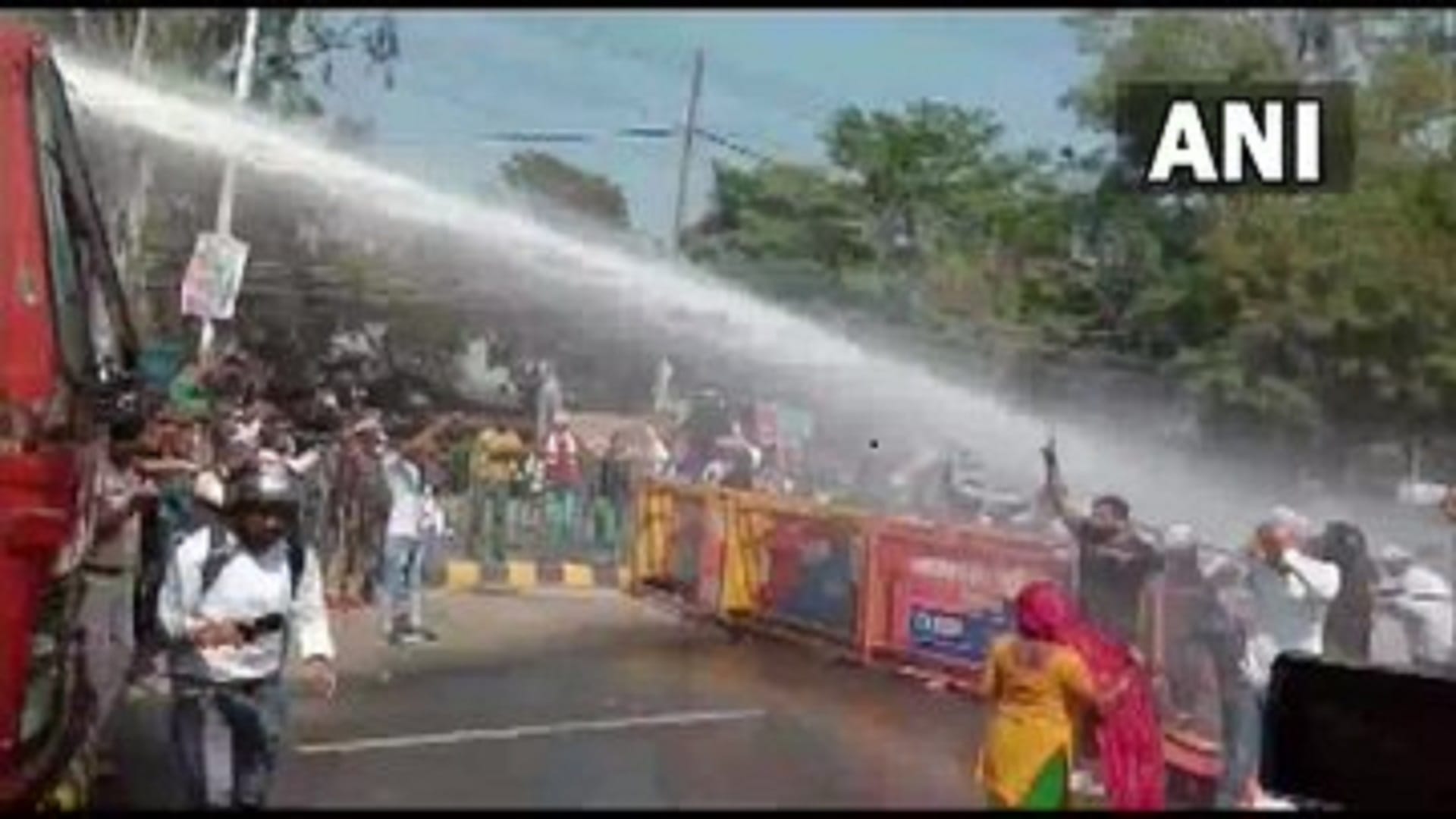 Police use water cannons to disperse the workers of Jan Adhikar Party
