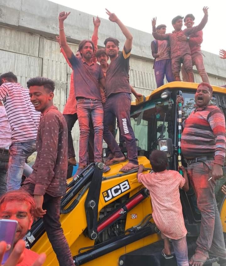 Procession taken out with bulldozers playing drums