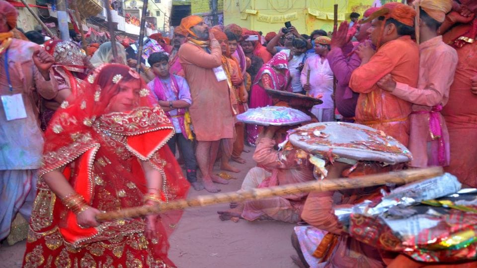 Lathmar Holi 2021 women and men played Lathmar Holi in Barsana Mathura