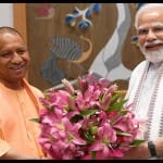 योगी आदित्यनाथ और पीएम मोदी।