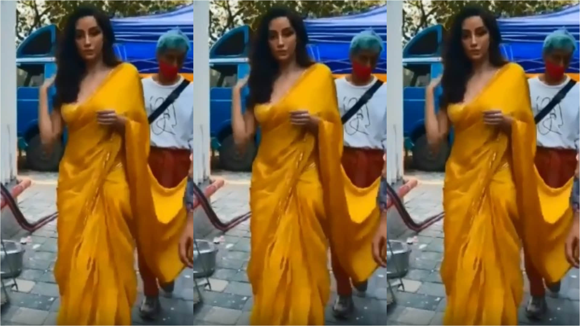 nora fatehi sizzling look in yellow satin saree