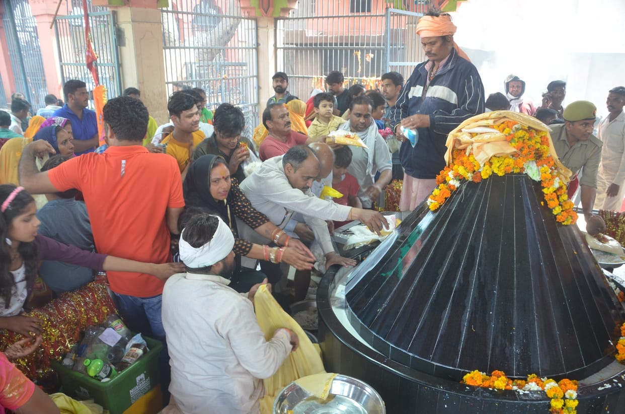 Crowd of devotees gathered in the cave Baba temple