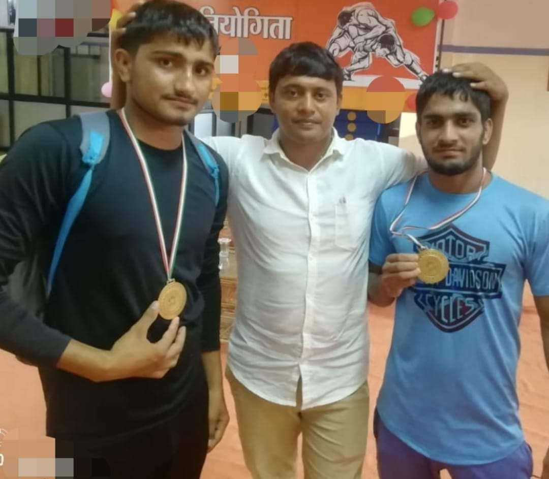 Two wrestlers took first place