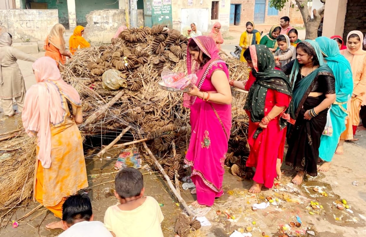 Praying for the happiness and peace of the family by worshiping Holika