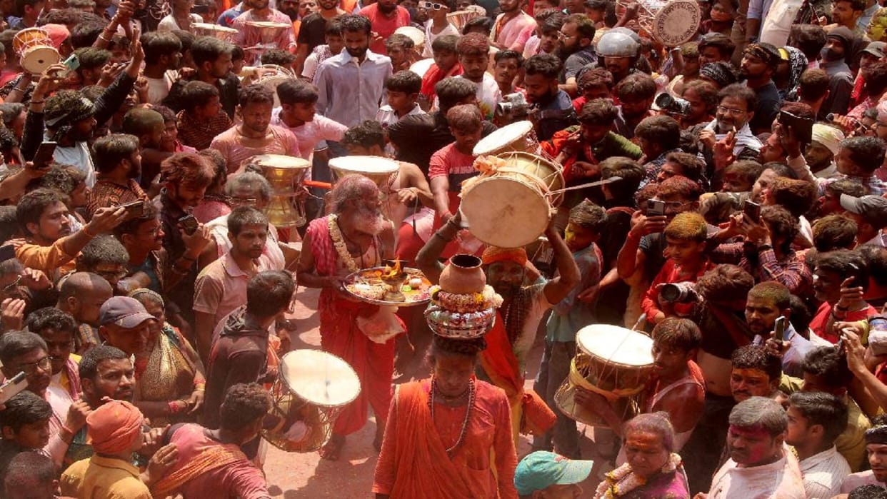 Muslim community welcomes Holi procession with perfume and flowers, a tradition being played in Varanasi for 50 years