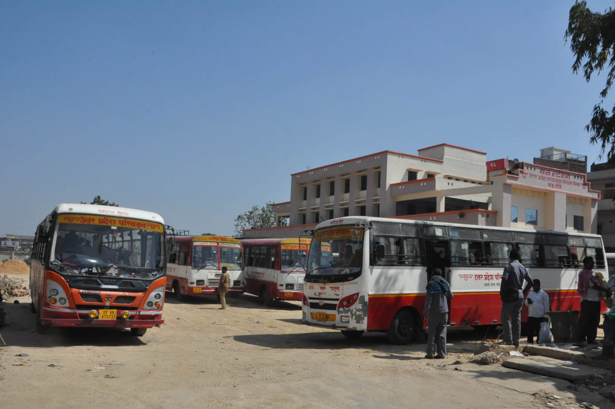 Crowd of passengers in buses and trains