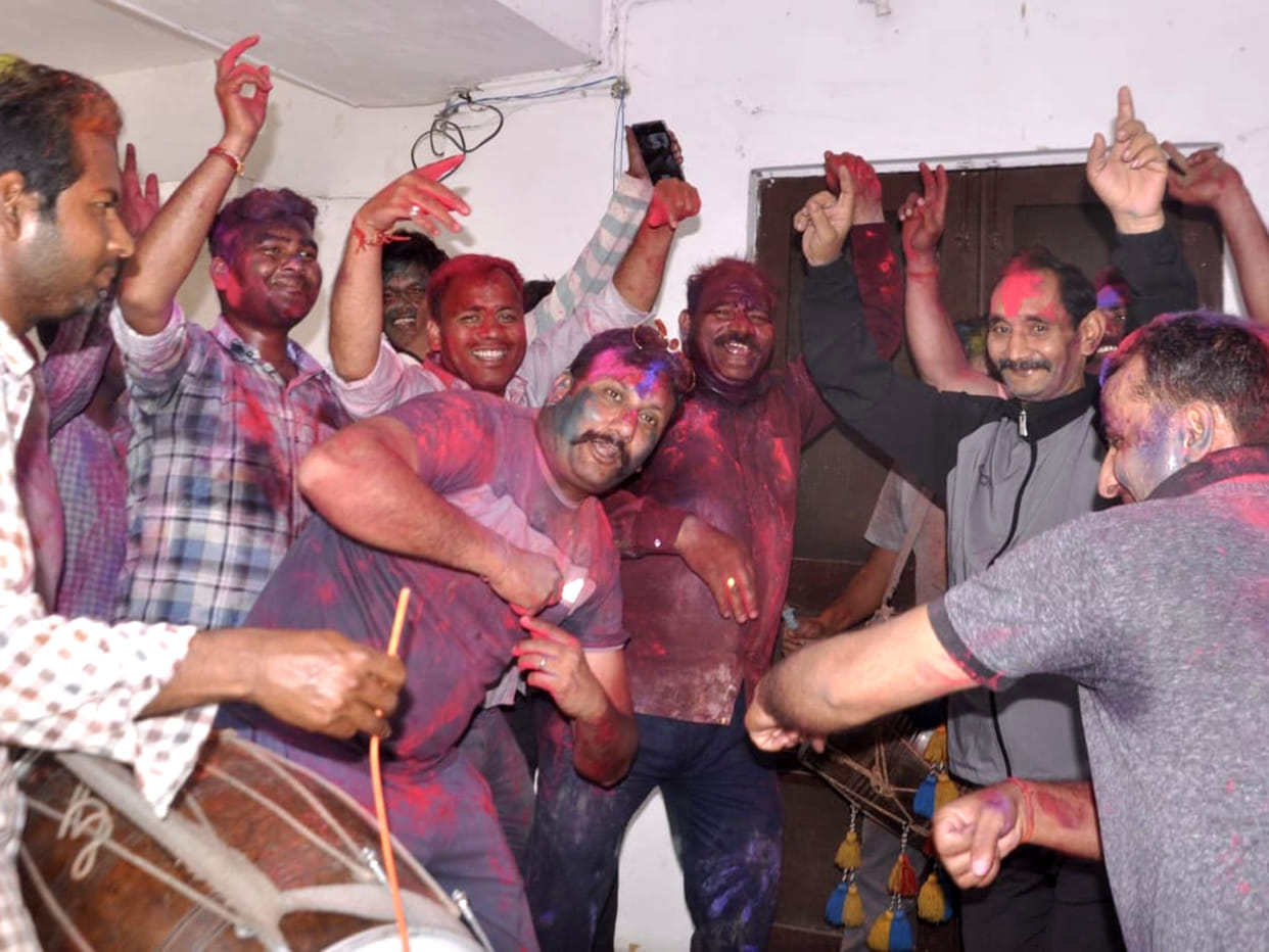 Police personnel dance to the beat of drum