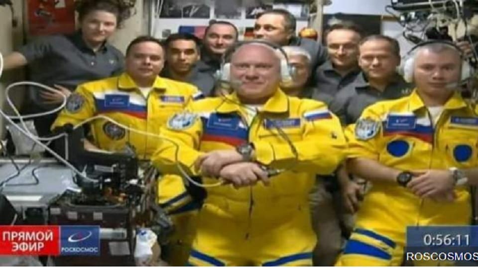 Russian Astronauts reaches Internation Space station in yellow blue flight suits