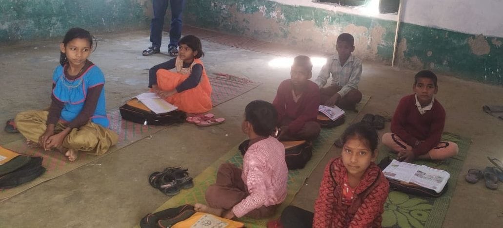 student donot seat on table