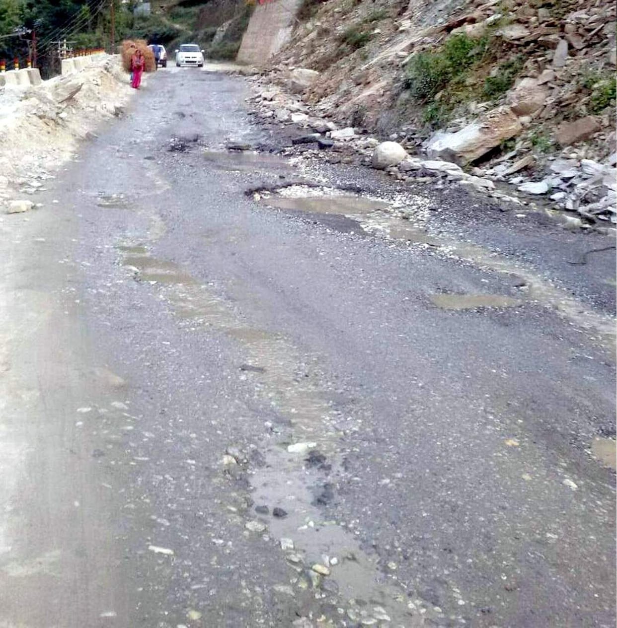 On the road Nandprayag-Saikot-Kothialsain, buttresses were broken, asphalt was uprooted