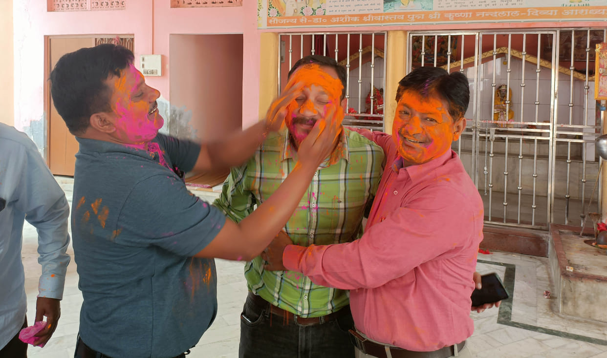 Happy Holi by applying Gulal