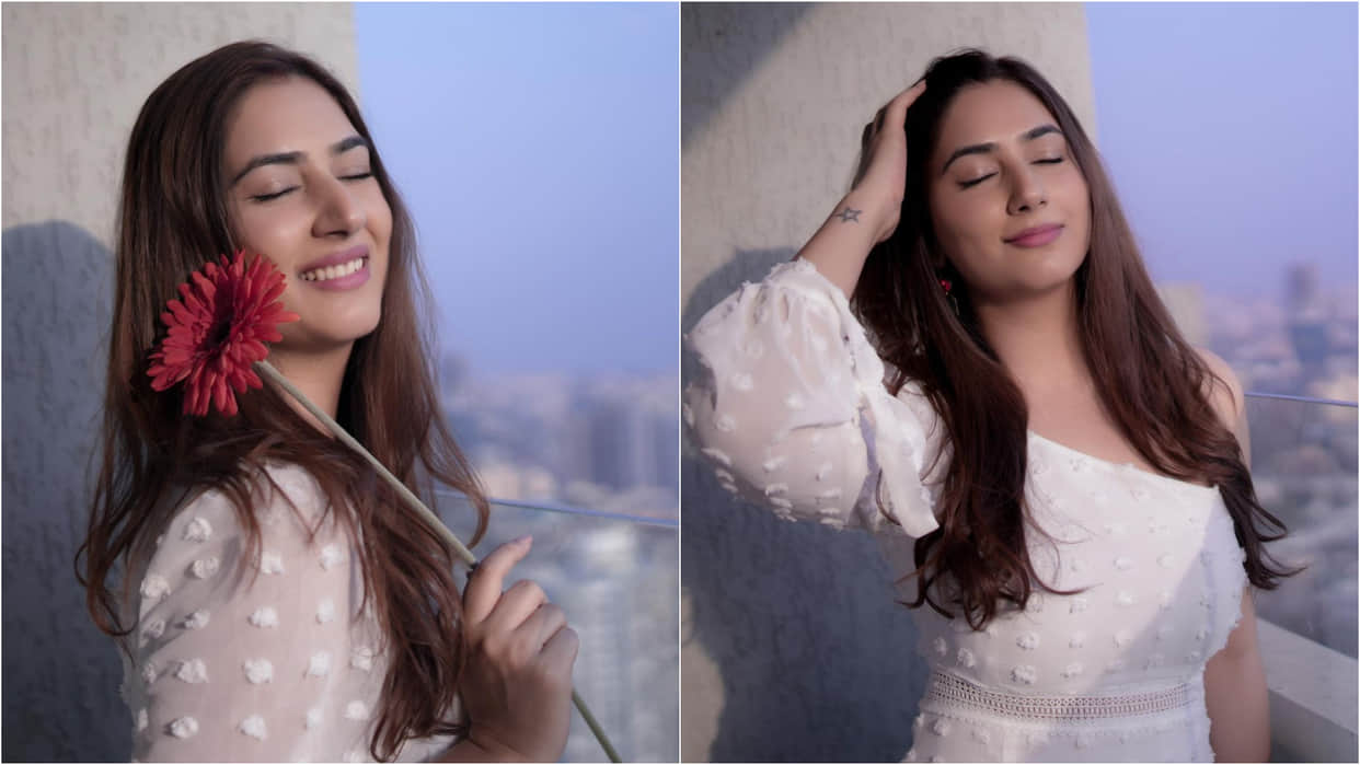 disha parmar stuns in satin blue shirt with distressed shorts husband rahul vaidya give reaction