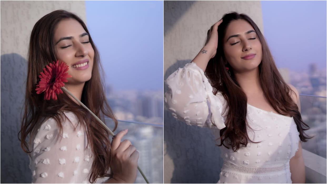 disha parmar stuns in satin blue shirt with distressed shorts husband rahul vaidya give reaction