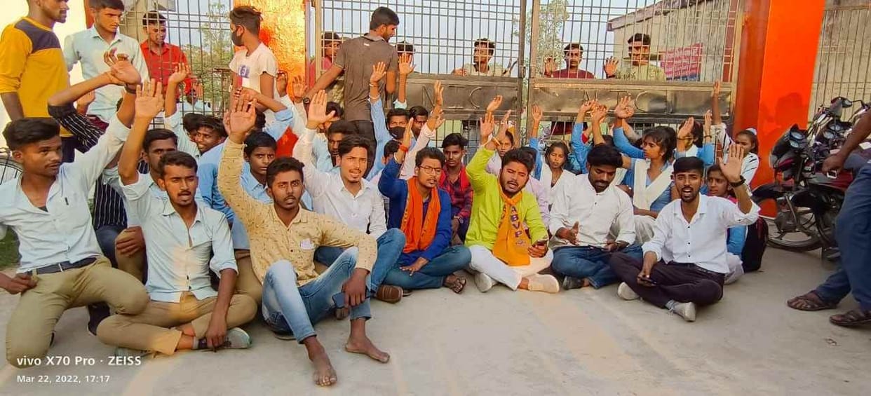 Students staged a sit-in at the school gate