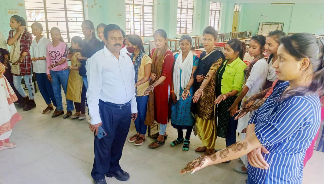 Mithlesh stood first and Komal second in henna competition