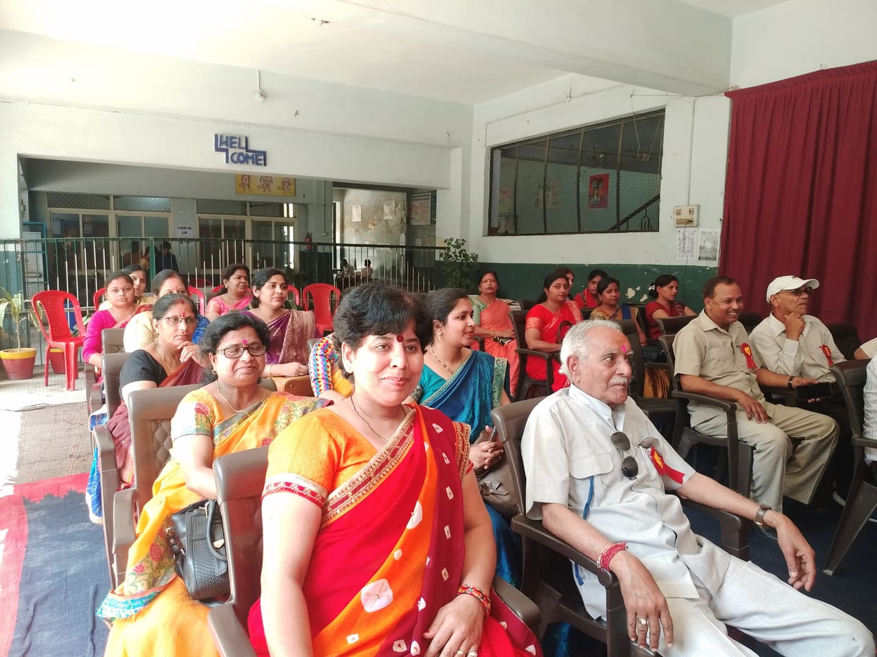 Secondary teachers gulal and hugged each other