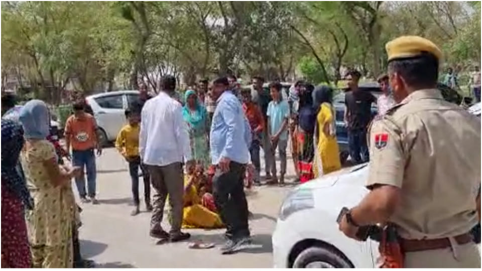 Relatives lying in front of SP Ajay Singh's car demanding to find girls