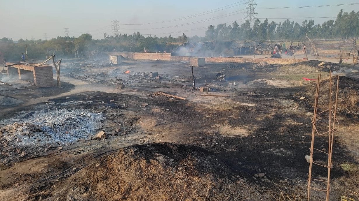 15 huts ashes by fire
