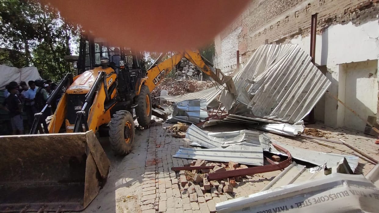 Bulldozer roared again at former MP Atiq Ahmed house boundary wall was demolished