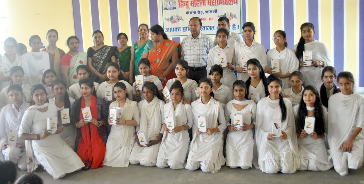 Students jump with joy after getting tablet, smartphone