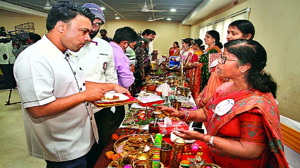 delicious dishes served on people plate in cooking competition held at indira gandhi national center