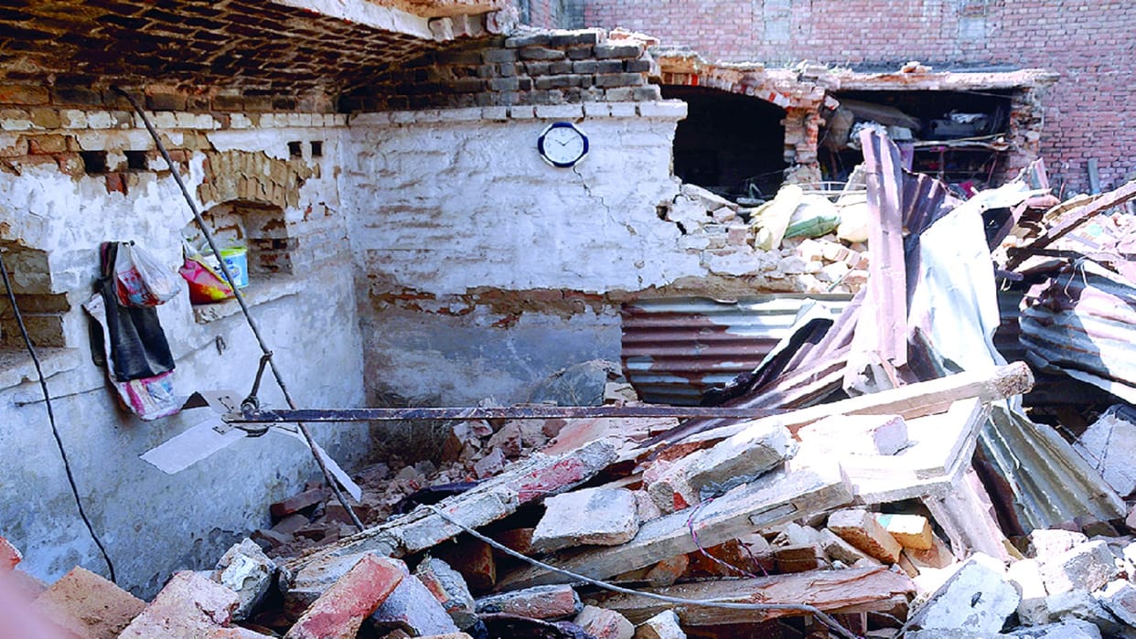 House demolished by bulldozer in dispute, jammed on highway in protest