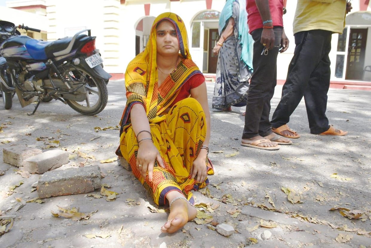 Woman accuses police of assault and robbery