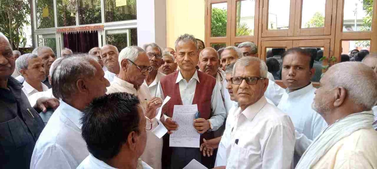 Retired roadways employees came to meet the MLA when the free journey in buses ended