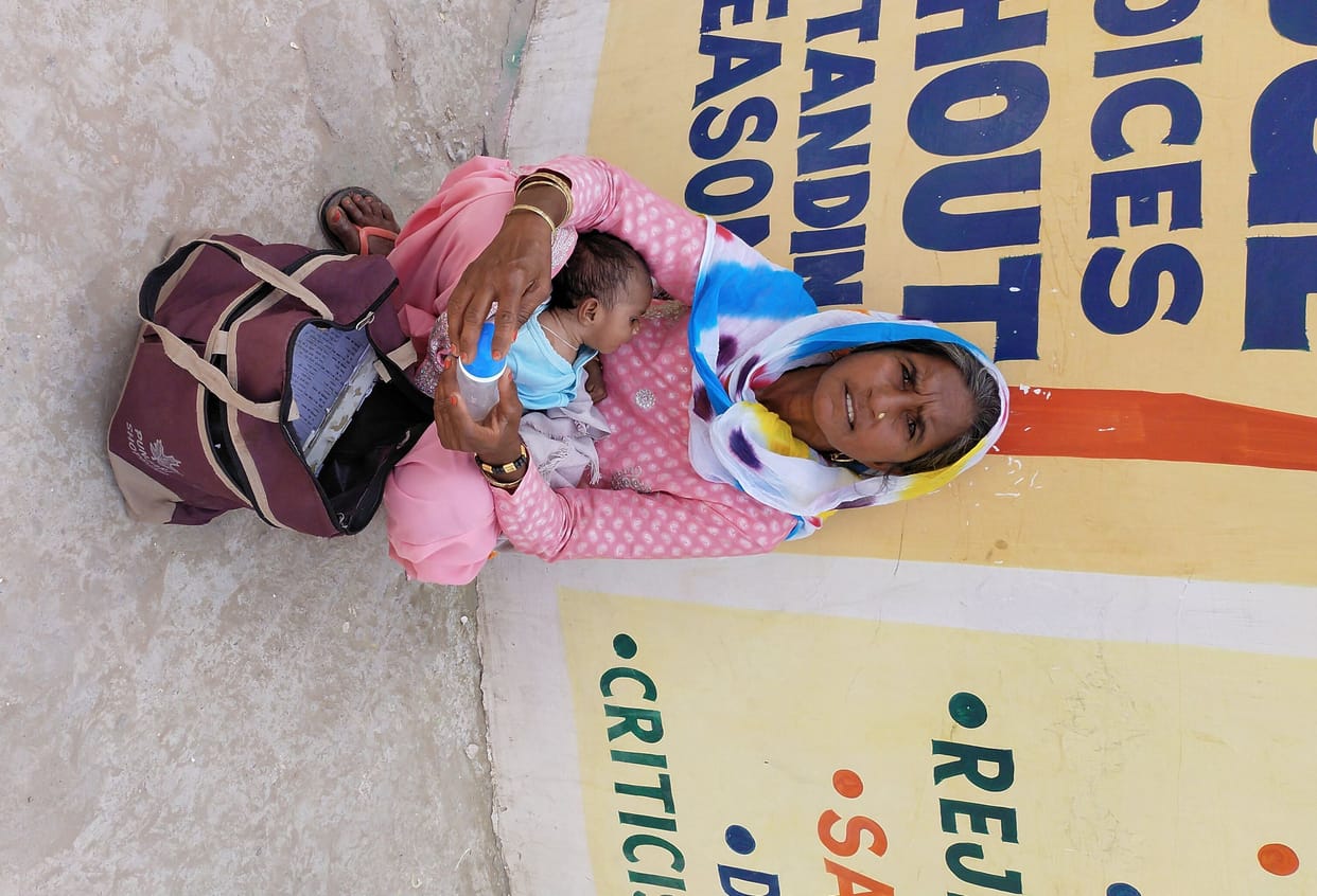 The mother took the test inside and the two to three-month-old babies took the test outside in the middle of the heat.