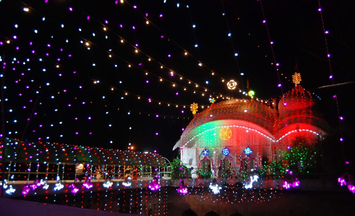 Devotees absorbed in the worship of Adi Shakti