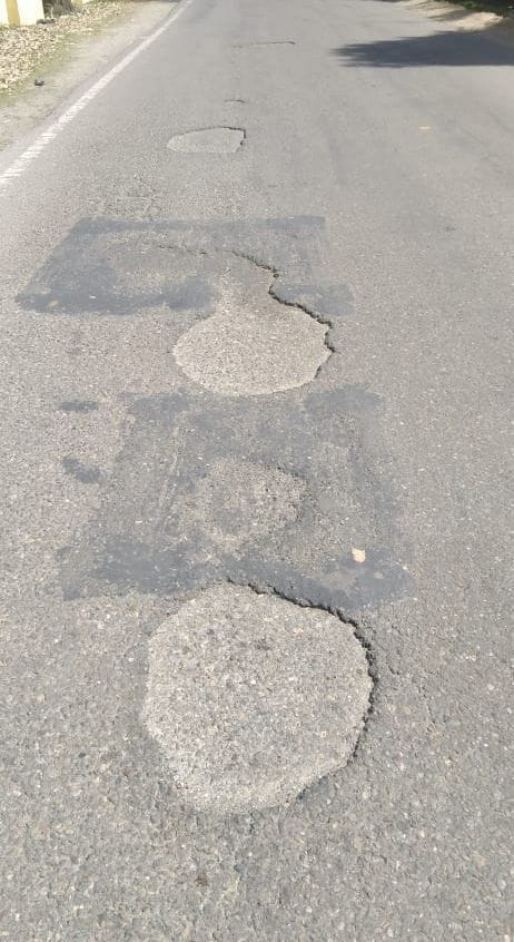 Potholes on NH, people are moving through Chamba-Jot road