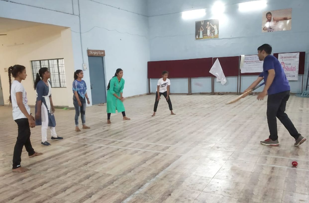 Girls practiced cricket, coach gave tips