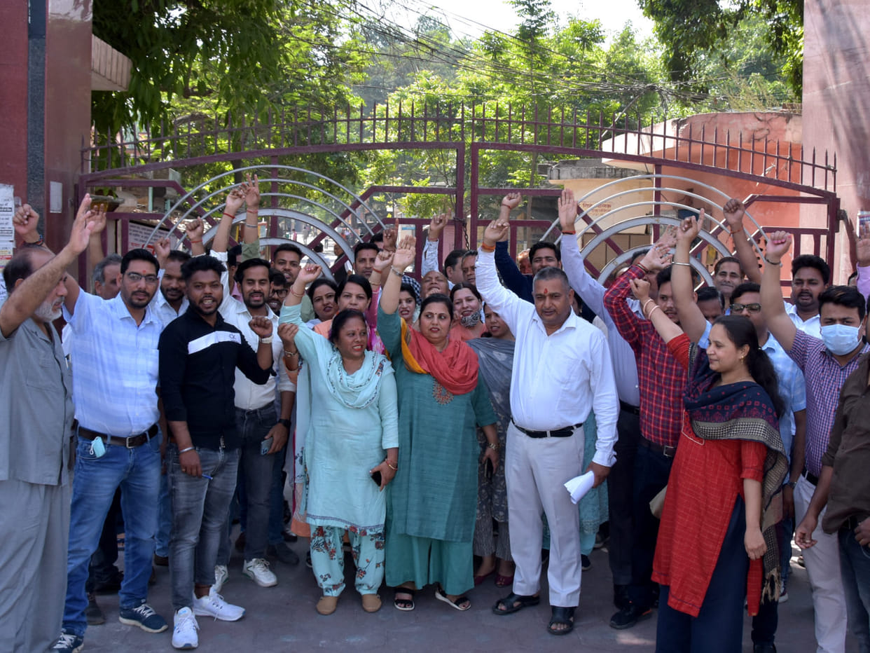 Collectorate personnel put a lock on the main gate, demonstrated