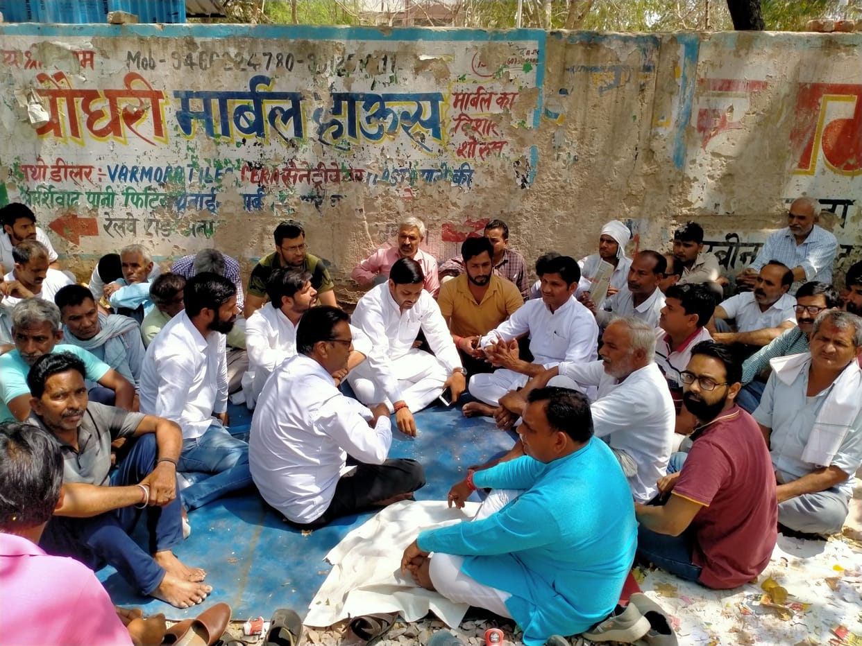 Shopkeepers sitting on indefinite dharna to protest against breaking of shops and kiosks