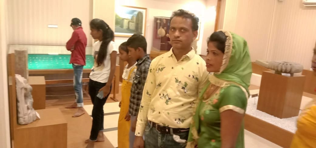 tourist watching culture in trilokpur musium