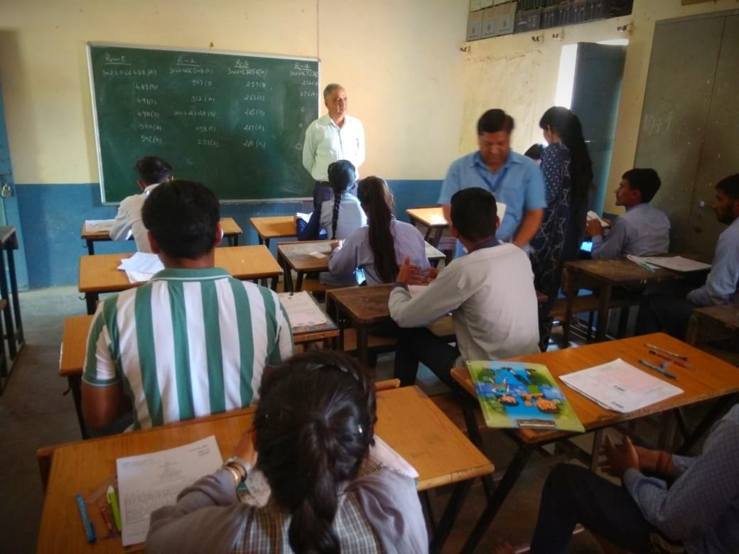 The student had hidden the answer sheet and the student had hidden the slips in the paper board