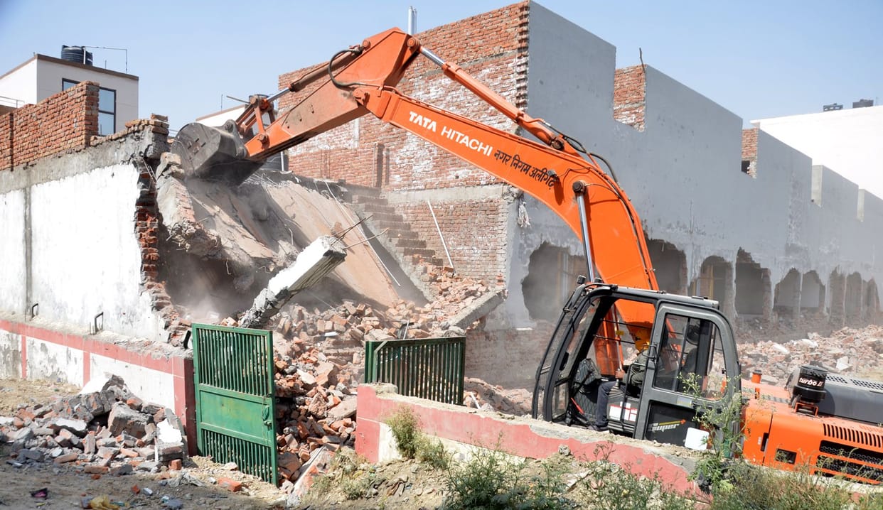 flats built on government land worth 20 crores bulldozers were used ruckus in land mafia