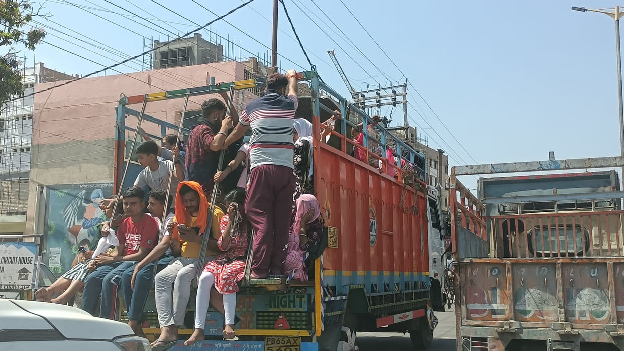 Cargo vehicles full of devotees passing by indiscriminately