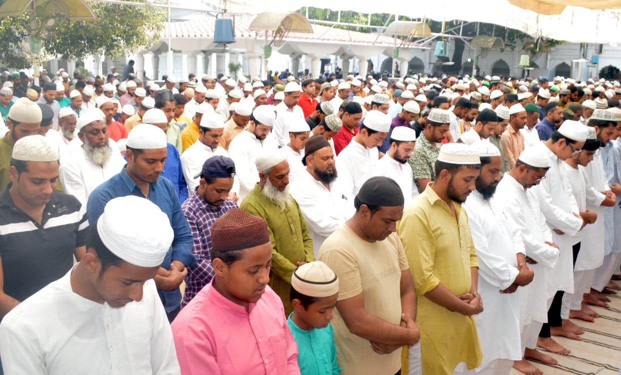 Hands raised to pray for peace
