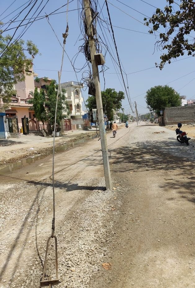 Electric poles standing in the middle of the road, the poles of the system are opening
