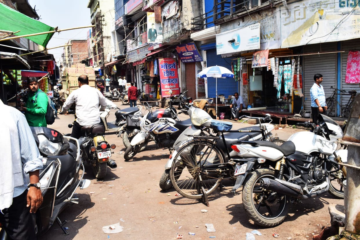 Vehicles parked on the roads opened shops in the parking lot