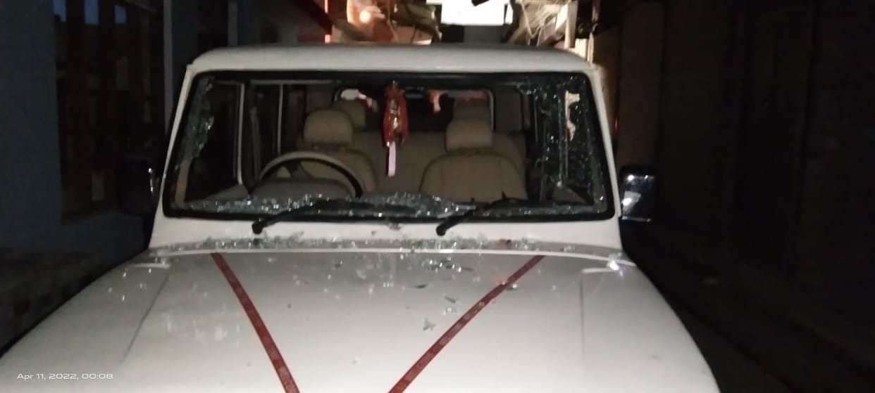 Stone pelting on two sides in religious event, glass of car broke