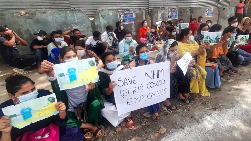 NHM Employees protest in jammu bakshi nagar demand revocation of termination order