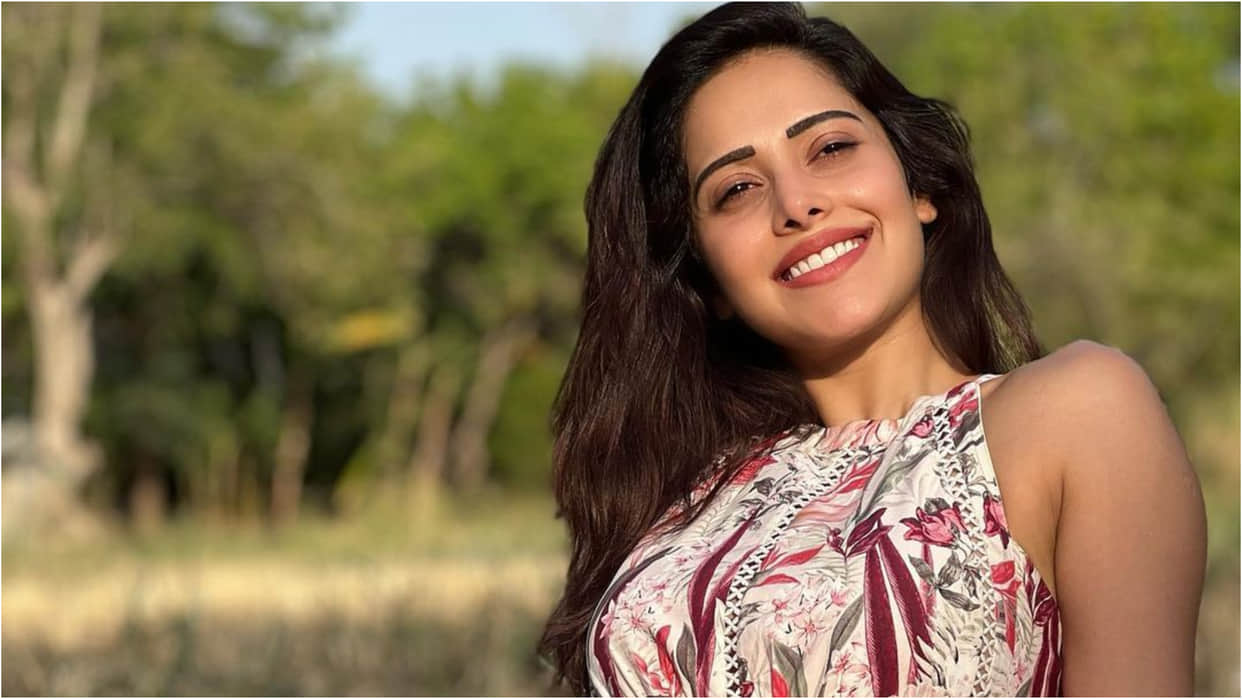 nushrat bharucha backless blouse with printed lehenga looks elegant