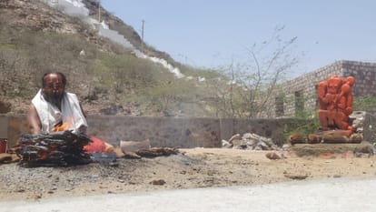 Amidst the scorching heat in Barmer baba is doing sadhna with a burning pot on his head middle of fire